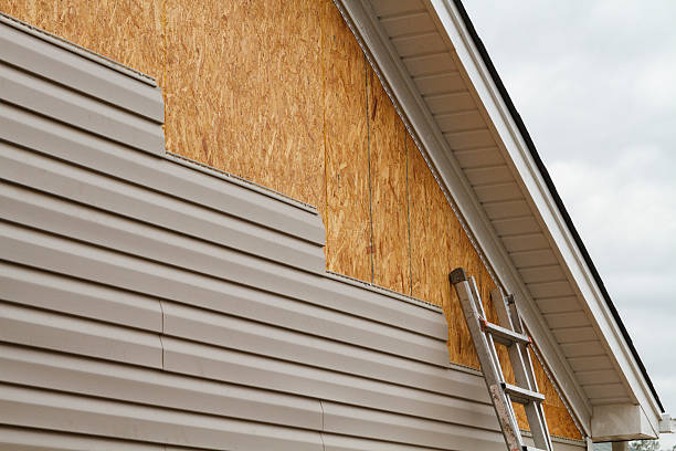 Professional Storm Damage Siding Repair technician working in Bokeelia, FL